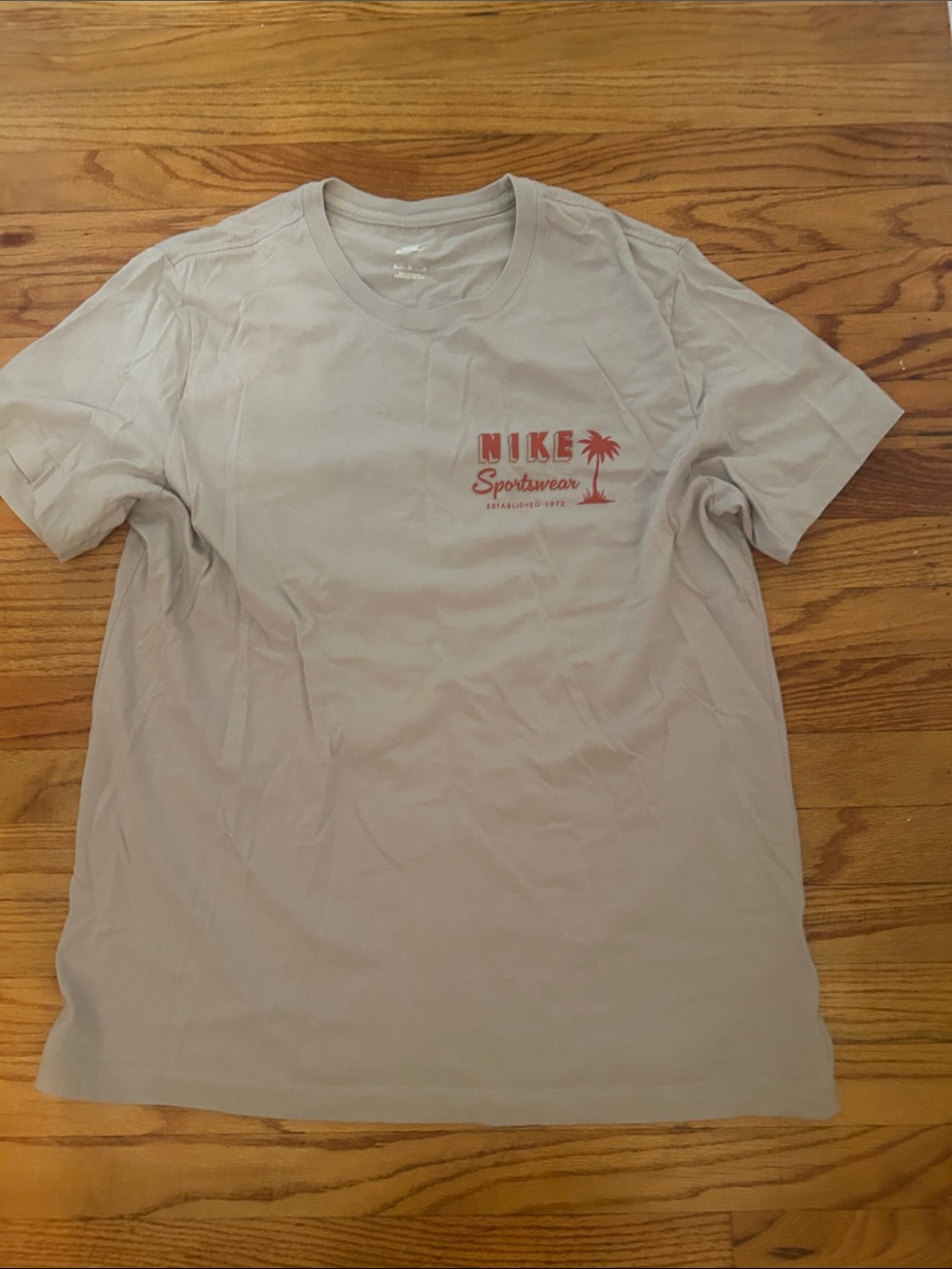 Retro Nike Men's Light Sand Short-Sleeve Tee with Red Logo